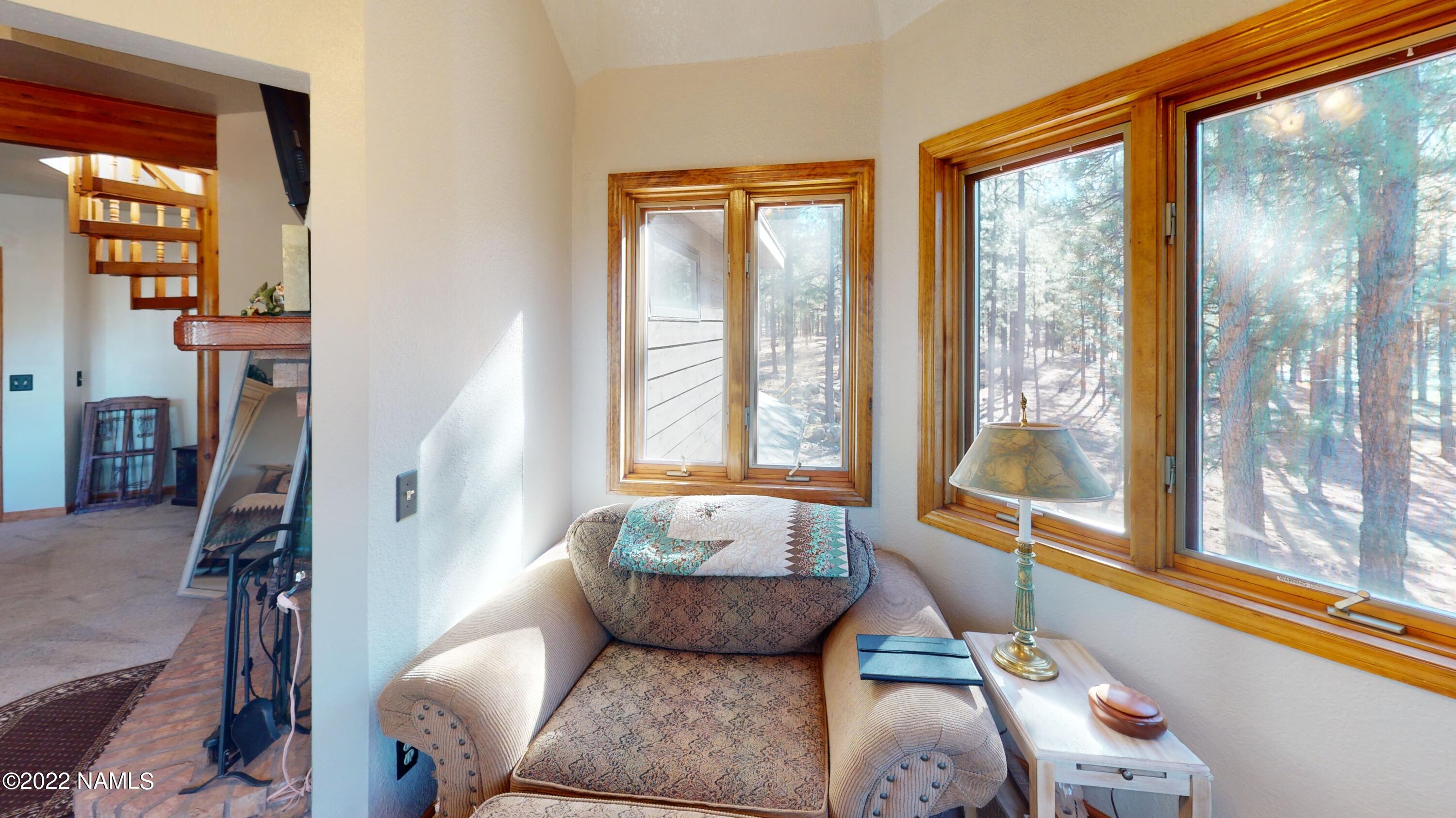 12830 East Thunder Rdg Road Parks, AZ 86018 - Photo 51 of 97 a living room with furniture and a large window