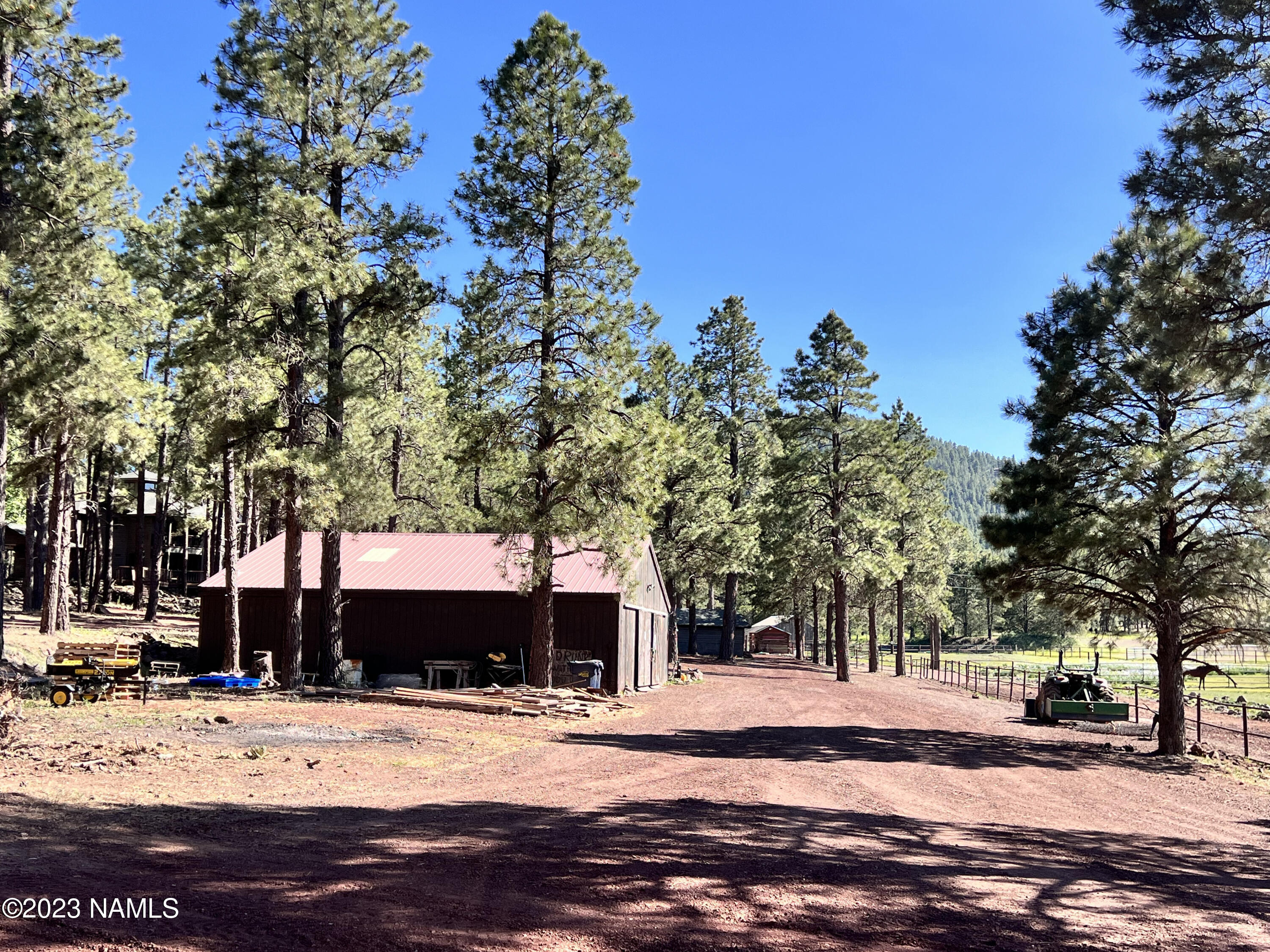 12830 East Thunder Rdg Road Parks, AZ 86018 - Photo 68 of 97 a view of a house with a tree covered with snow