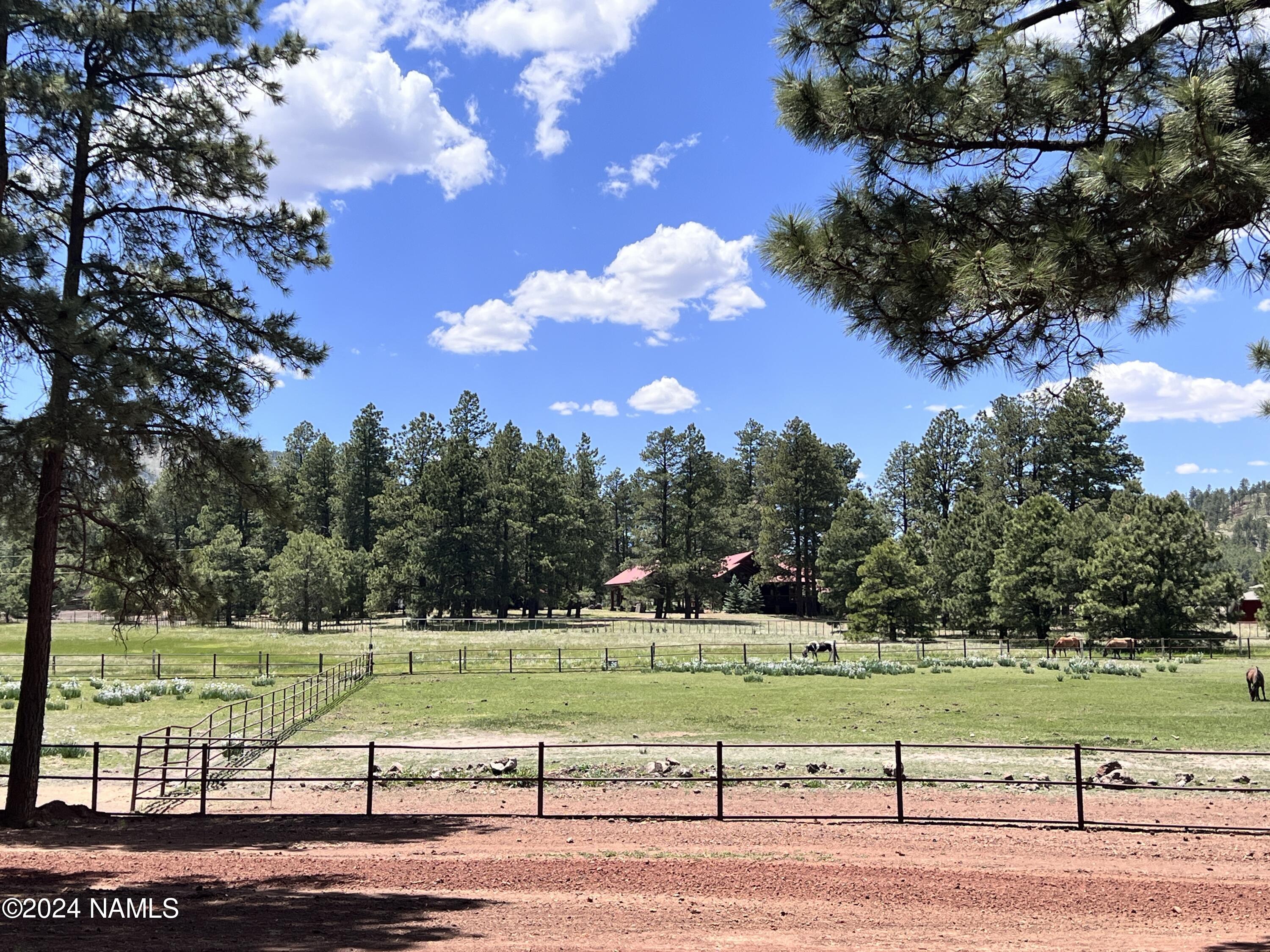 12830 East Thunder Rdg Road Parks, AZ 86018 - Photo 81 of 97 a view of a golf course with a lake