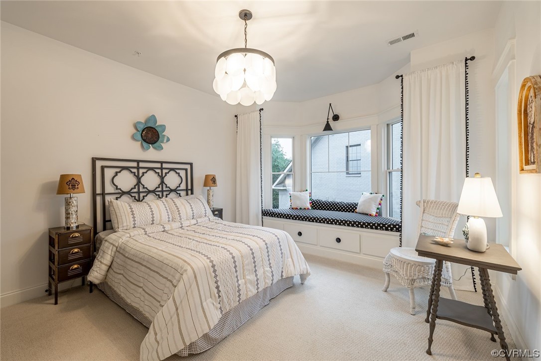 3508 Ormiston Grove Circle Henrico, VA 23233 - Photo 29 of 50 a bedroom with a bed and a chandelier