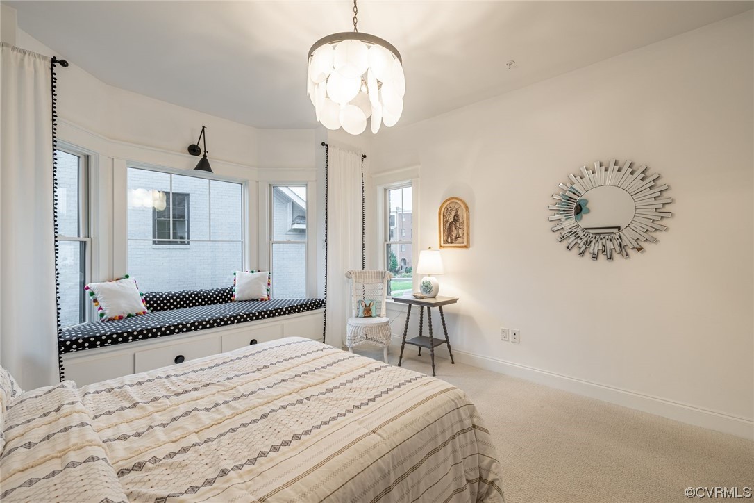 3508 Ormiston Grove Circle Henrico, VA 23233 - Photo 30 of 50 a bedroom with a bed and a chandelier