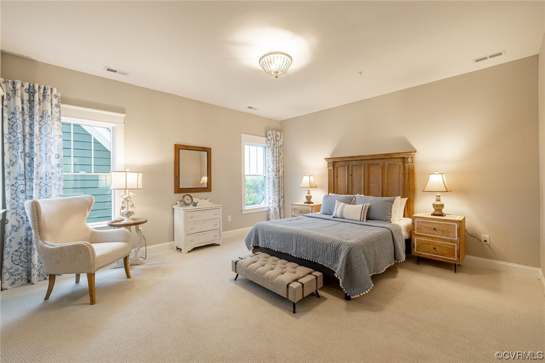 3508 Ormiston Grove Circle Henrico, VA 23233 - Photo 33 of 50 a spacious bedroom with a bed and a couch