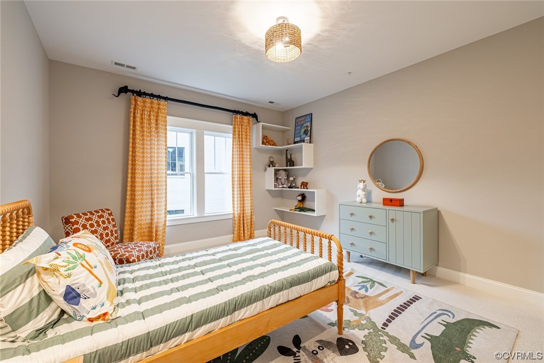 3508 Ormiston Grove Circle Henrico, VA 23233 - Photo 37 of 50 a bedroom with a bed and a dresser