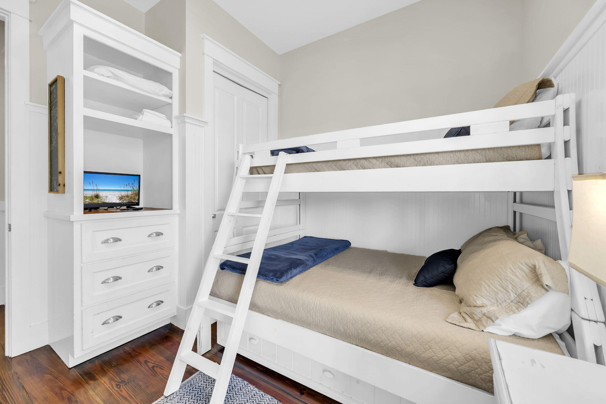 48 Cast Net Lane Seacrest, FL 32461 - Photo 15 of 41 a bedroom with a bed and a flat tv screen on dresser