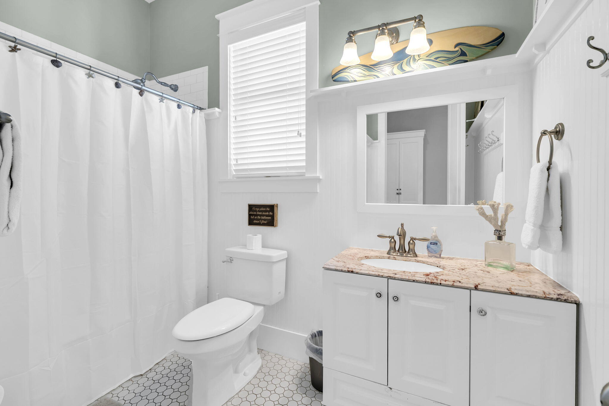 48 Cast Net Lane Seacrest, FL 32461 - Photo 16 of 41 a bathroom with a toilet sink and mirror