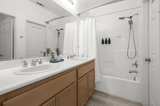 a view of house with swimming pool and patio