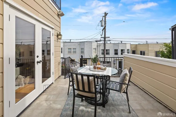 a table and chairs in front of a building