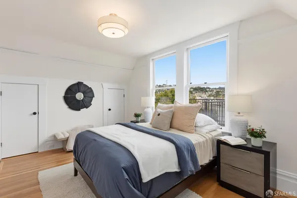 a bedroom with a bed and window