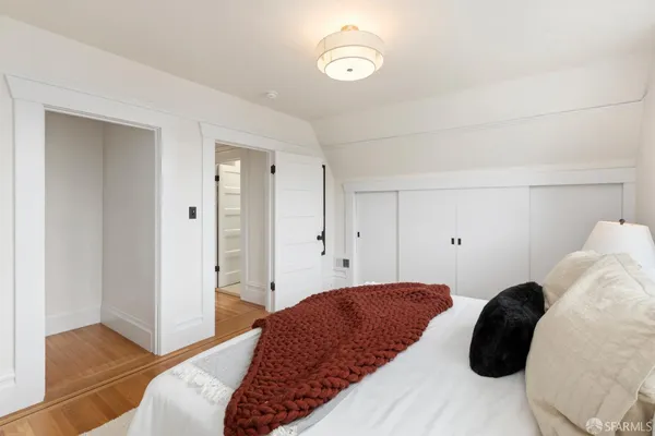 a bedroom with a bed and walk in closet