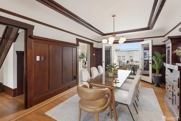 a dining room with furniture and window