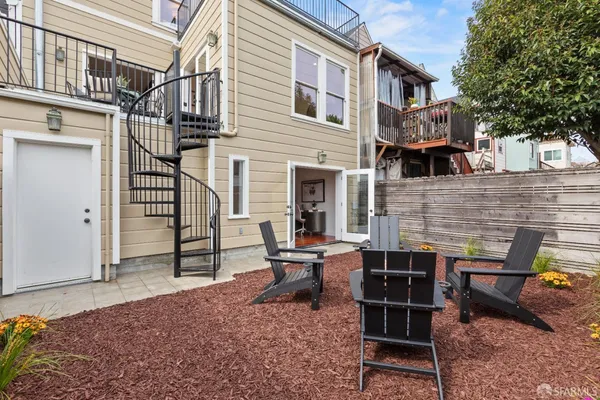 a backyard of a house with seating space