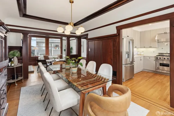 a dining room with furniture and window