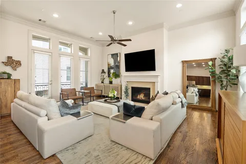 a living room with furniture fireplace and a flat screen tv