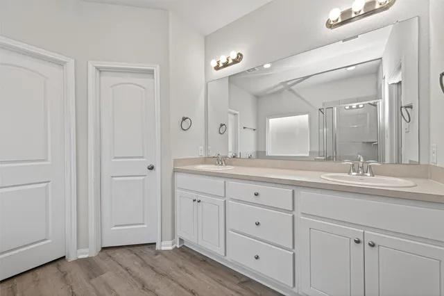 a white bath tub sitting in a en suite bathroom