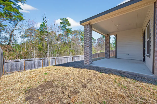a house view with a backyard space