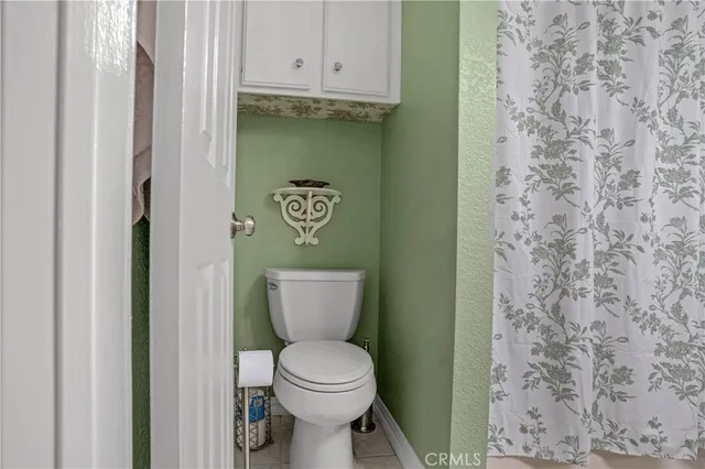 a bathroom with a toilet and a sink