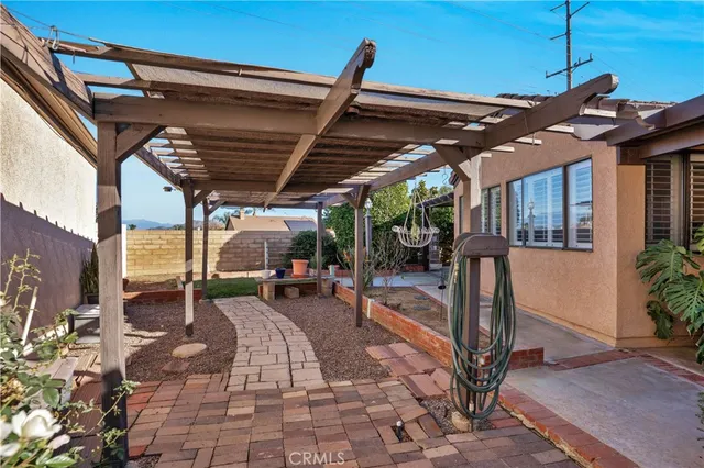a patio with a table and chairs