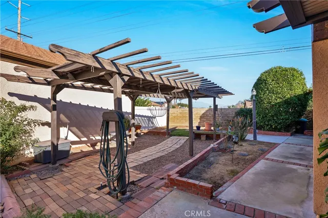 a view of a house with backyard porch and sitting area