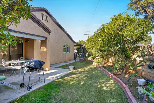 a patio with table and chairs