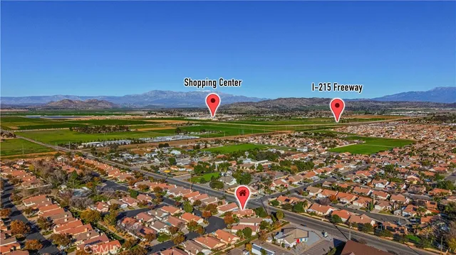 an aerial view of house with yard