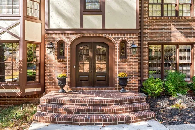 a view of entryway with wooden floor and windows