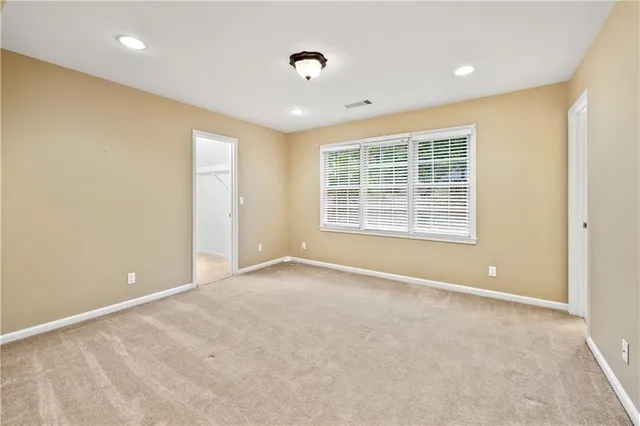 a view of a hallway with paintings on the wall