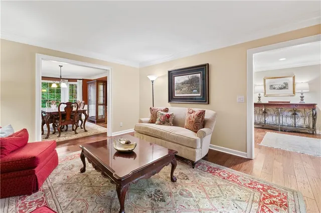 a living room with furniture red walls and a window