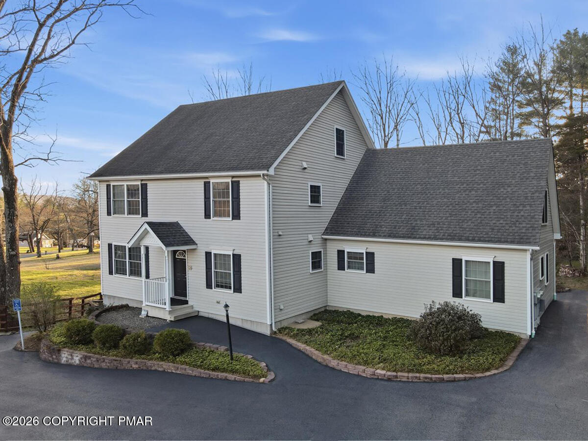 457 Hickory Valley Road Stroudsburg, PA 18360 - Photo 4 of 50 a front view of a house with a yard