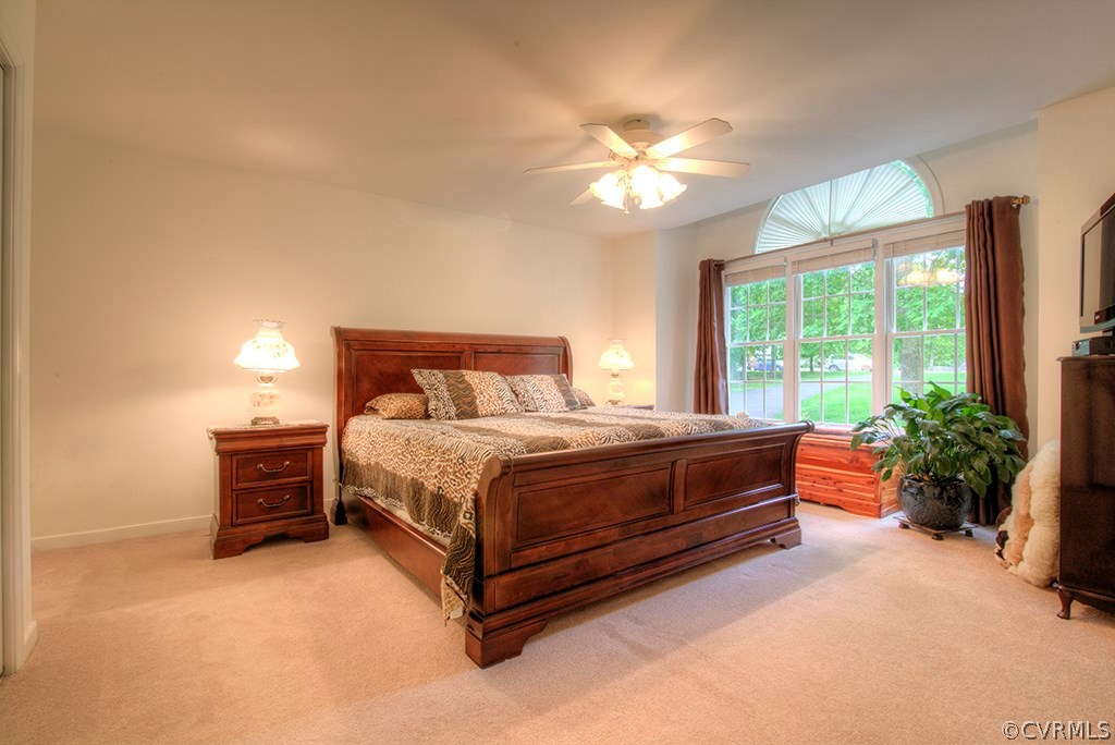 12607 Balta Road Chesterfield, VA 23838 - Photo 4 of 27 a bedroom with a bed and a chandelier