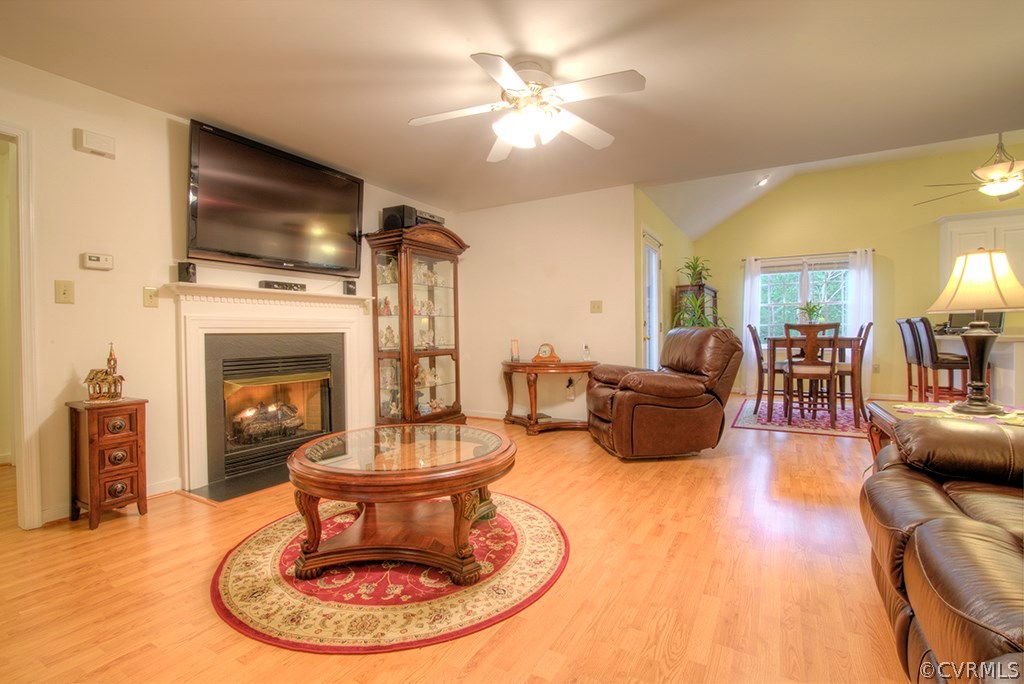 12607 Balta Road Chesterfield, VA 23838 - Photo 8 of 27 a living room with furniture a fireplace and a flat screen tv