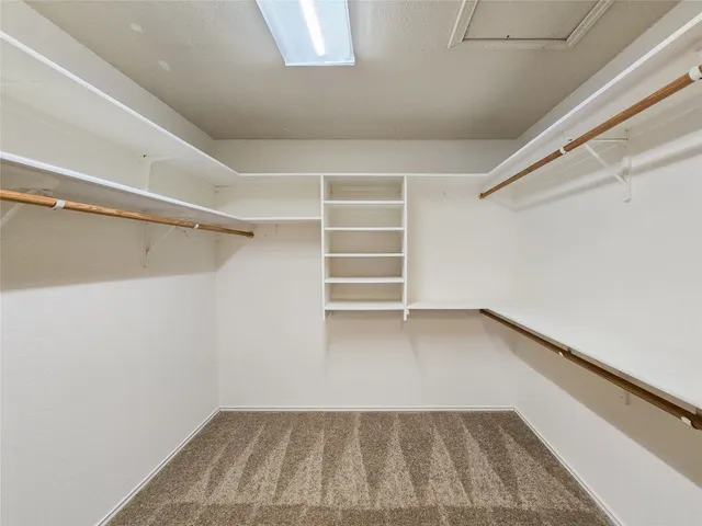 a view of an empty walk in closet