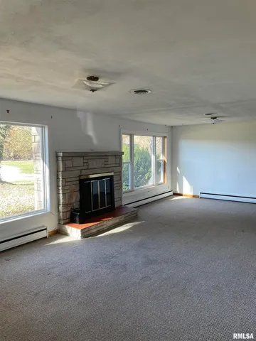 a view of an empty room with a window