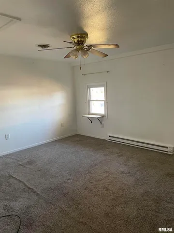 an empty room with a empty space and a window