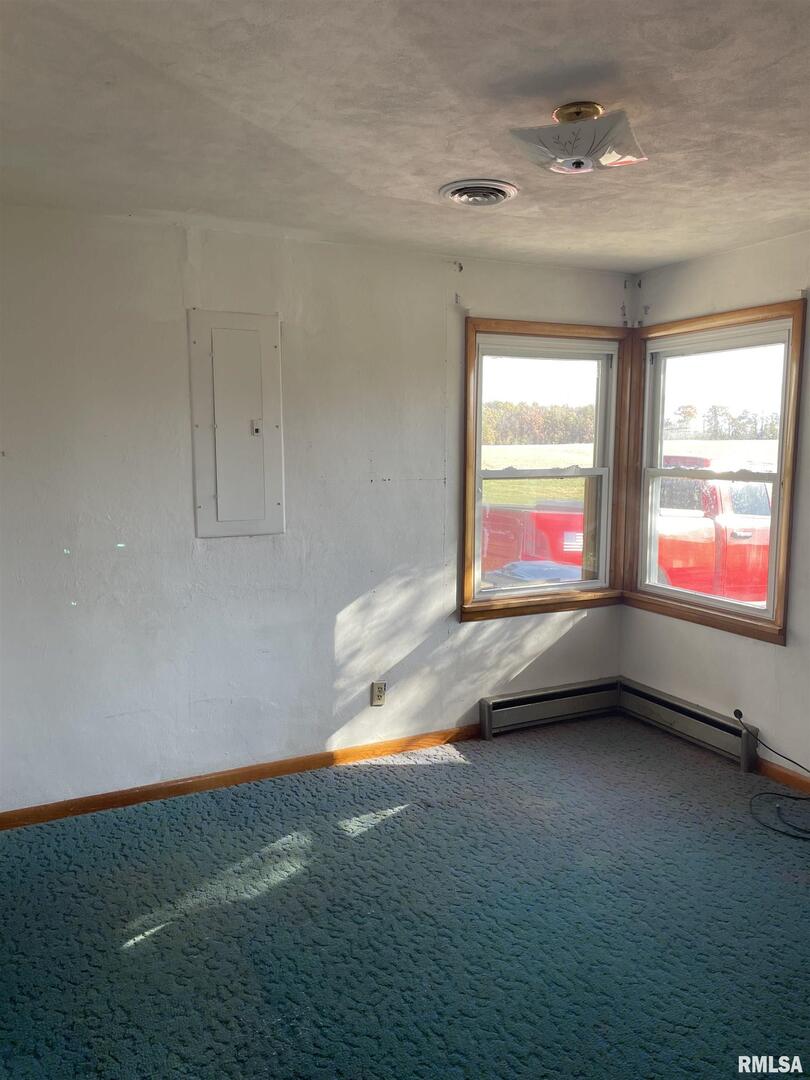 17726 Quiet Acres Road Scheller, IL 62883 - Photo 9 of 19 a view of an empty room with window