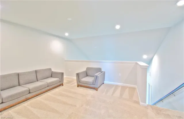 a living room with furniture and a couch