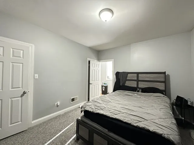 a bedroom with a bed and a cabinets