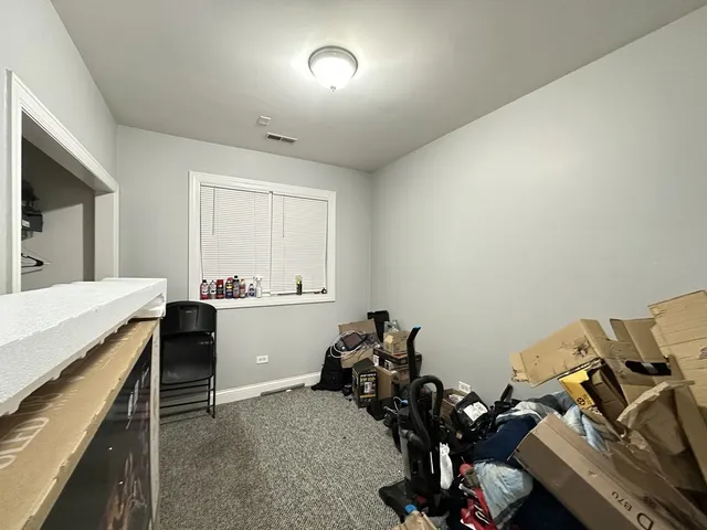 a room with a couch and a dresser