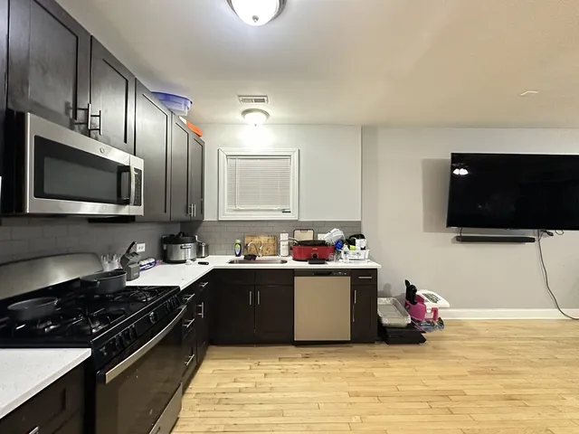 a kitchen with a stove and a microwave