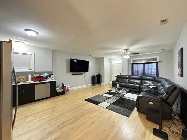 a bed room with furniture and a flat screen tv