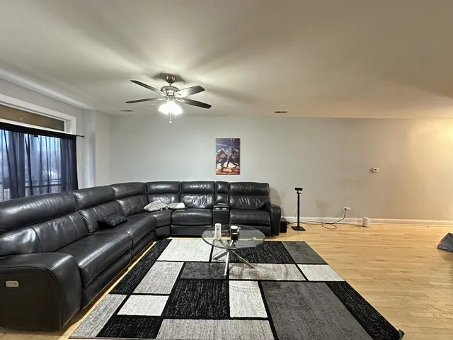 a living room with a couch and a rug