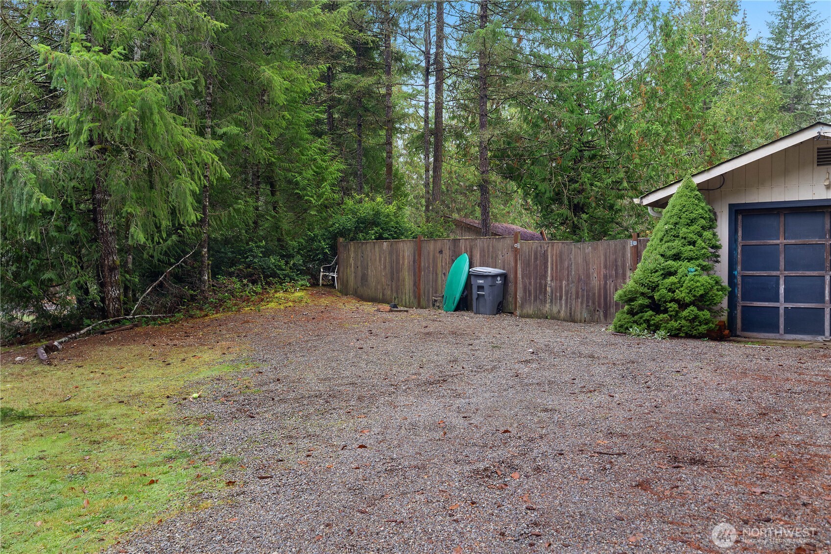 310 East Olde Lyme Road Shelton, WA 98584 - Photo 5 of 34 a view of a backyard with potted plants