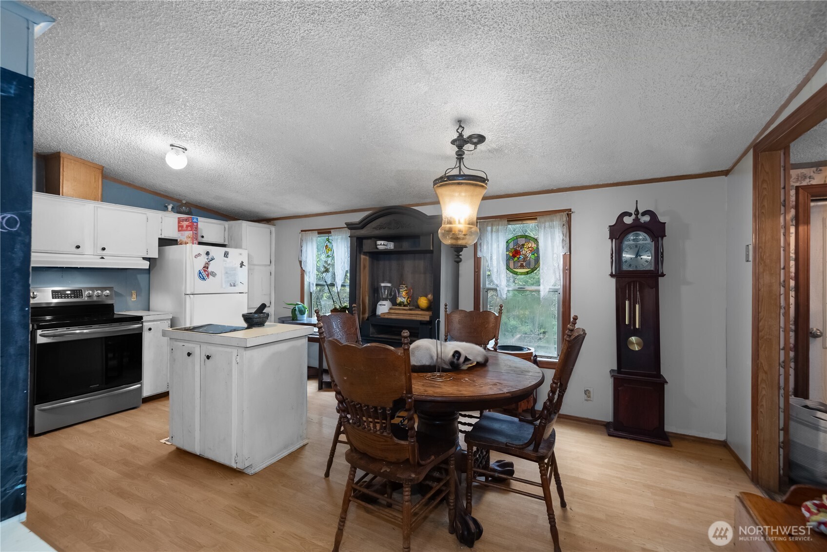 310 East Olde Lyme Road Shelton, WA 98584 - Photo 7 of 34 a view of a dining room with furniture window and wooden floor