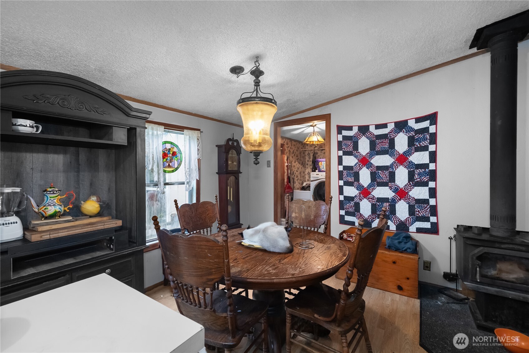 310 East Olde Lyme Road Shelton, WA 98584 - Photo 8 of 34 a view of a dining room with furniture and chandelier