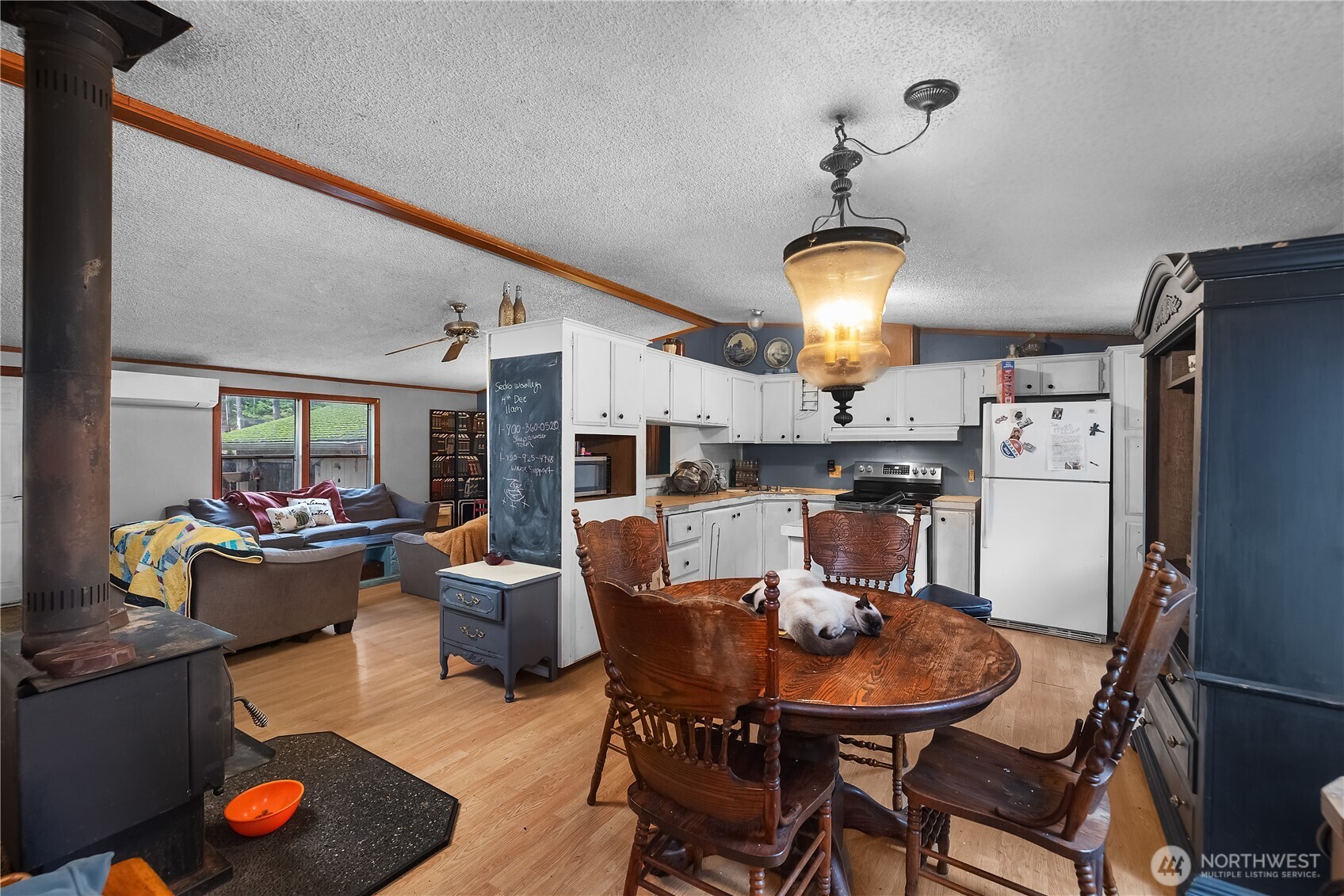 310 East Olde Lyme Road Shelton, WA 98584 - Photo 9 of 34 a view of a dining room with furniture wooden floor and chandelier