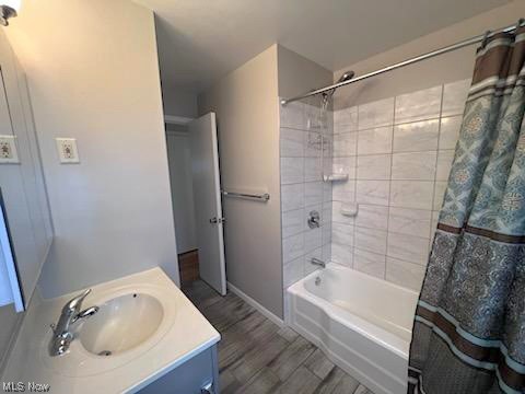 11701 Fordham Road Garfield Heights, OH 44125 - Photo 11 of 19 bathroom features tub/shower combo with custom tile work and updated plumbing