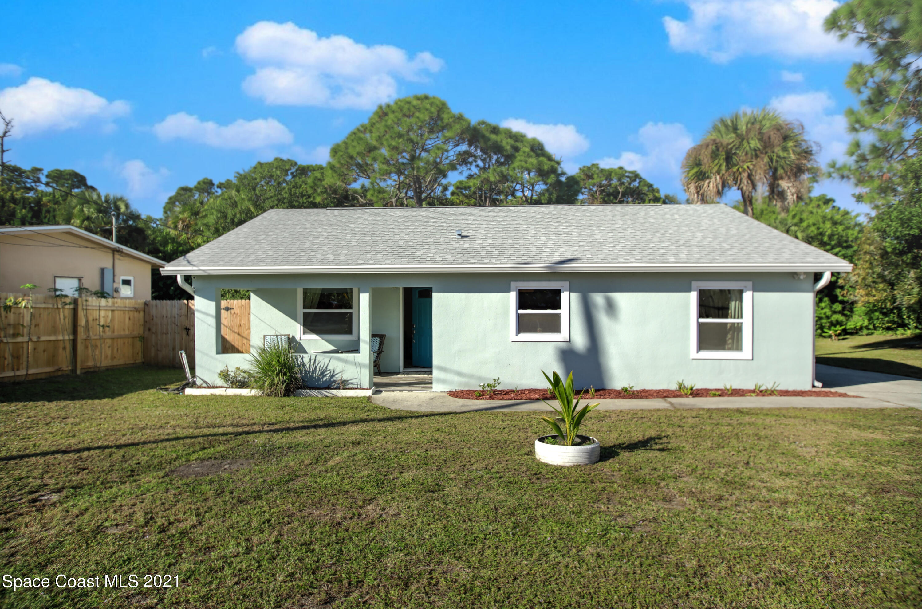 1896 Keewin Avenue Palm Bay, FL 32905 - Photo 2 of 23 a front view of a house with garden