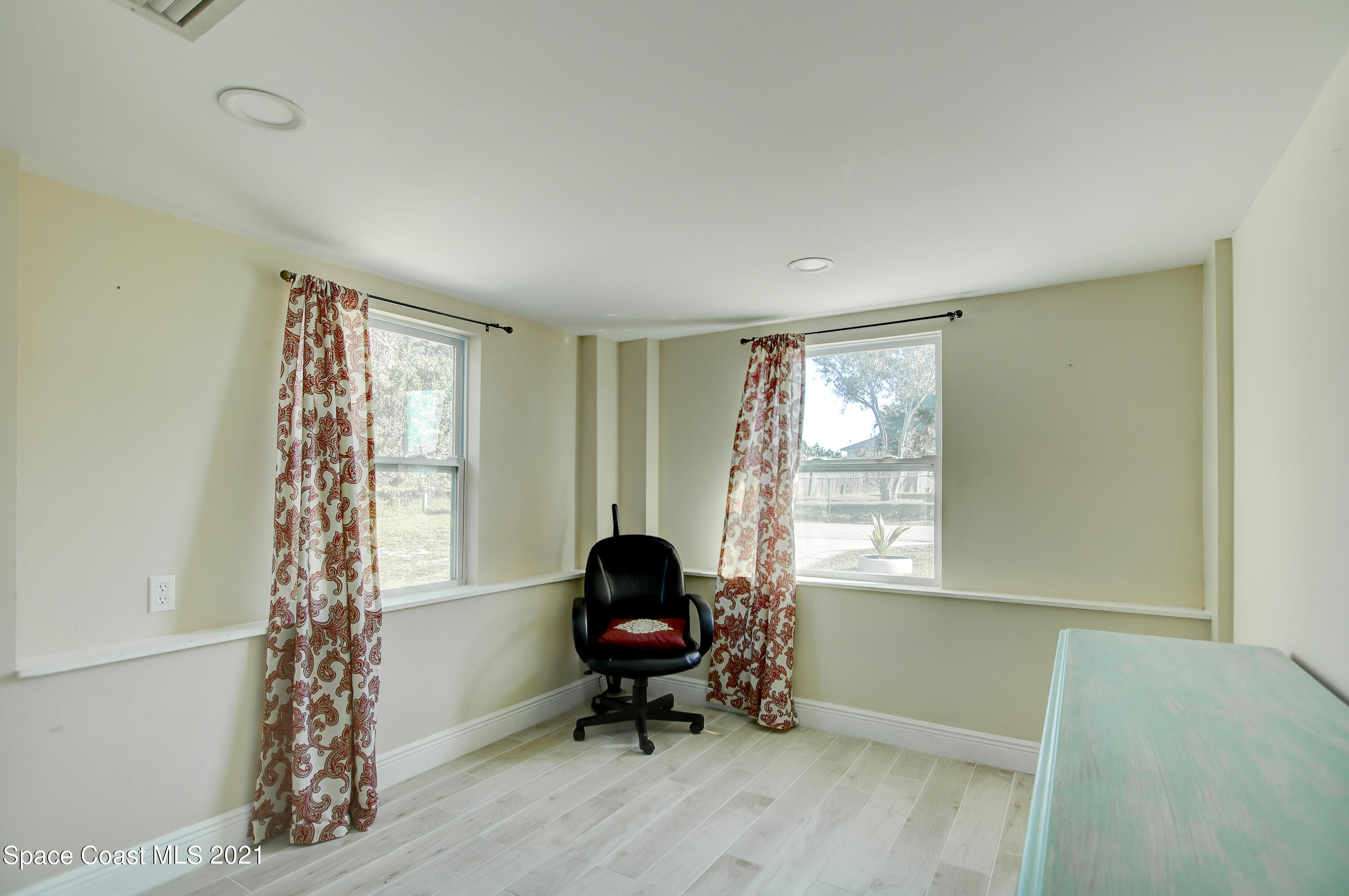 1896 Keewin Avenue Palm Bay, FL 32905 - Photo 17 of 23 a living room with furniture and a window