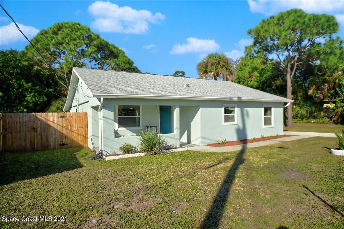 1896 Keewin Avenue Palm Bay, FL 32905 - Photo 3 of 23 a front view of a house with a yard and porch