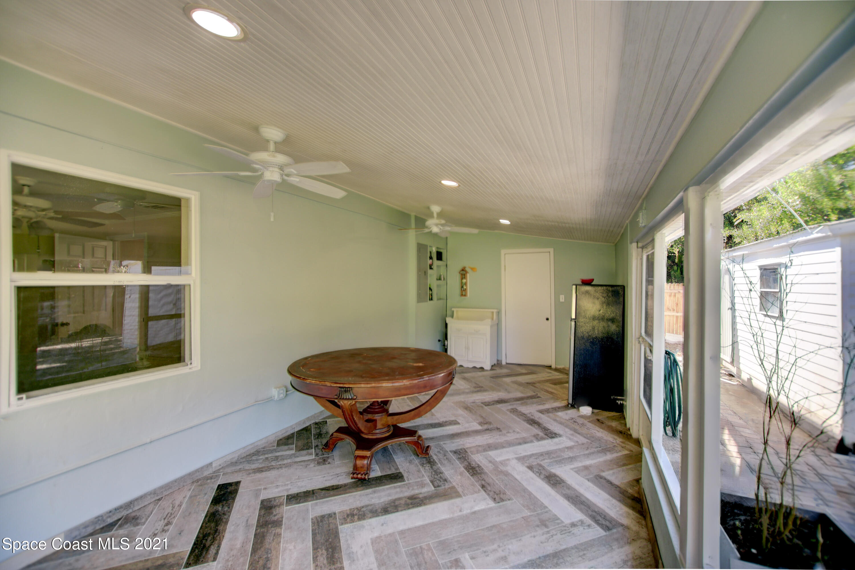 1896 Keewin Avenue Palm Bay, FL 32905 - Photo 22 of 23 a view of a livingroom with furniture and windows