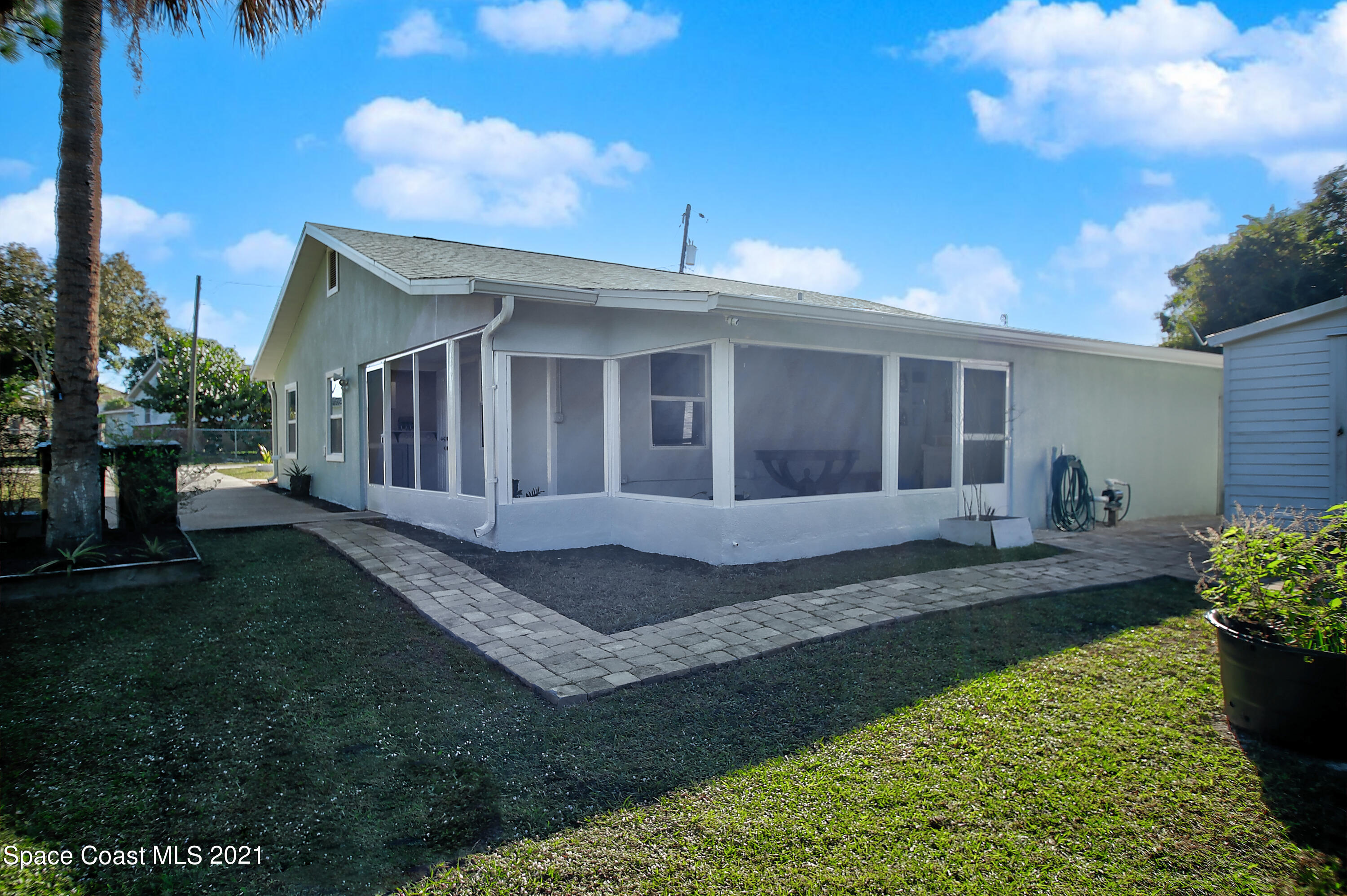 1896 Keewin Avenue Palm Bay, FL 32905 - Photo 23 of 23 a view of a house with backyard and porch